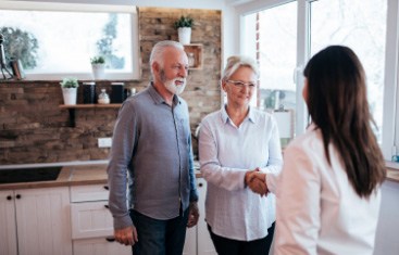 older couple talking to dentist